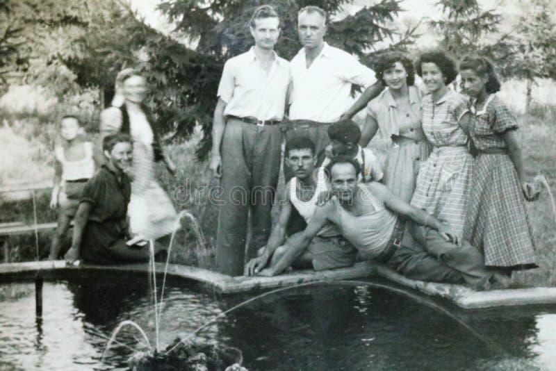 Vintage black and white photo of a group of young people, friend, family. 1950s fashion. Social history. Vintage black and white photo of a group of young people, friend, family. 1950s fashion. Social history.